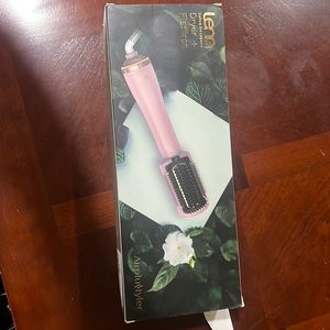 Brand new dryer and flat iron. Pink. Never been used.